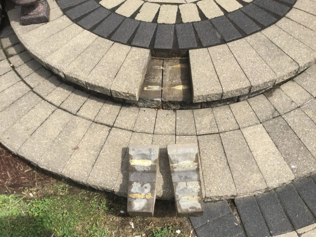 Loose pavers of a spiral step.
